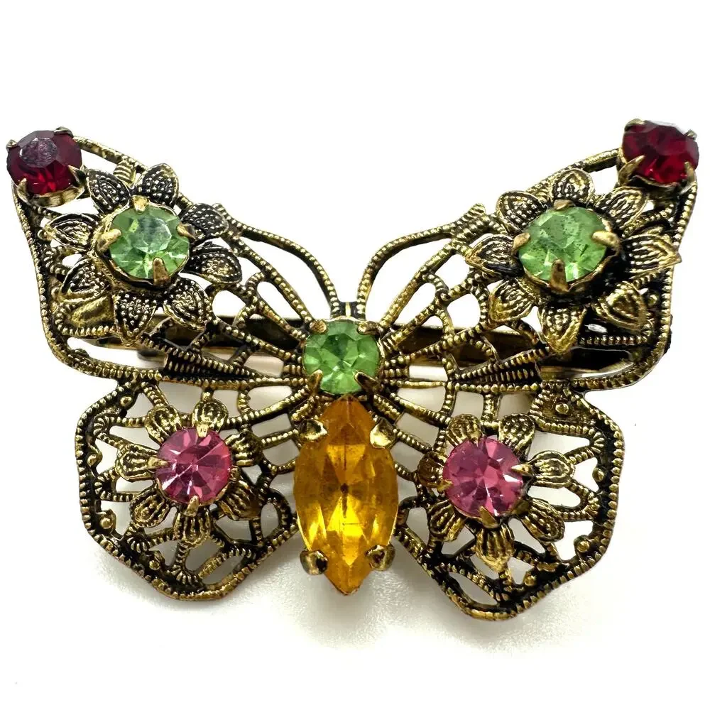 Vintage gold tone filigree multicolor prong set rhinestones butterfly brooch